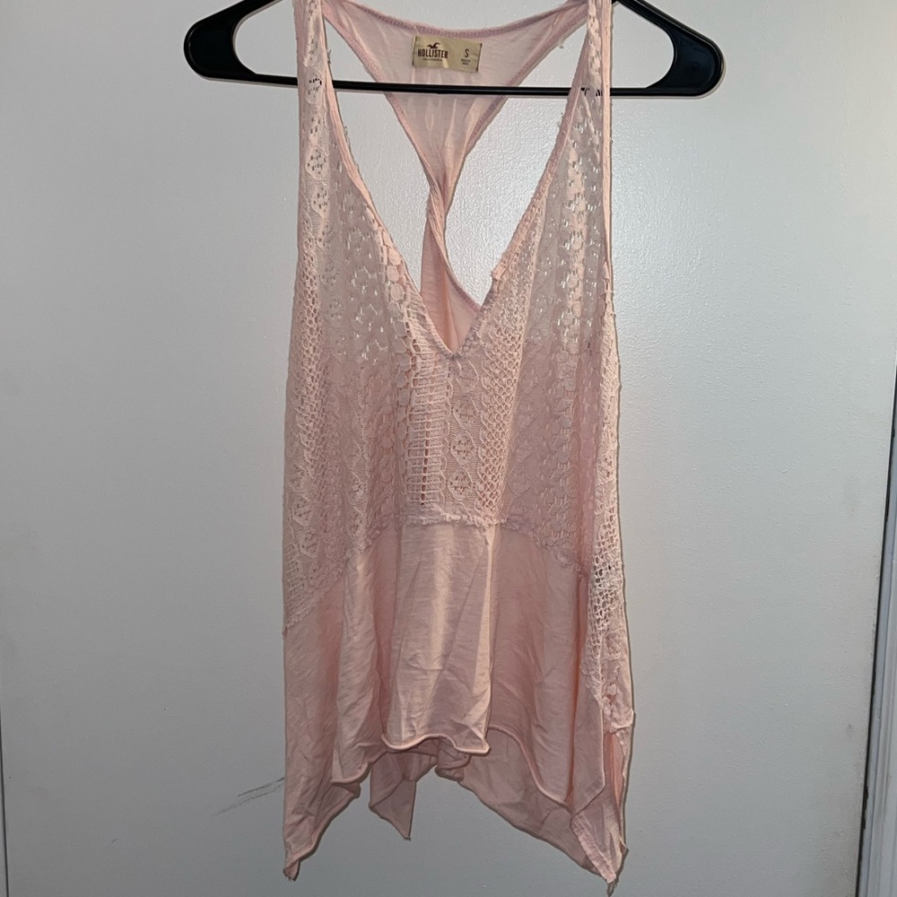 Pink tank top from Hollister. Has lace around the top and twists in the back.